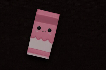 Adorable squishy toy on black background. Plastic toy