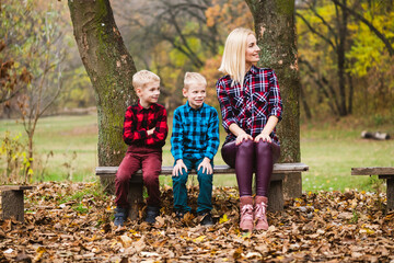Family look of mom and boys outdoors