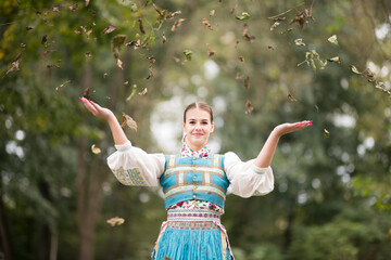 Beautiful young woman in slovak folk dress. Slovak folklore.