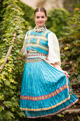 Beautiful young woman in slovak folk dress. Slovak folklore.