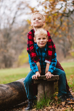 Portrait Of Blonde Twin Brothers In Hugs