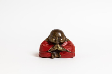 Fat Buddha dressed in red on a white background Chinese Buddha.