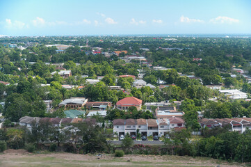 wide, high angle view of a tropical city on the island of Jamaica on a sunny spring day