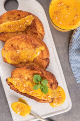 Traditional Christmas Rabanadas with egg yolk cream and cinnamon. Spanish Torrijas close up on the countertop.