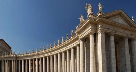 Fototapeta na wymiar Panorama of Statues on St Peters piazza colonnades