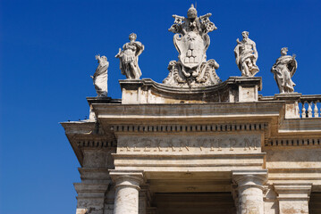 Detail of Vatican coat of arms on St Peters square colonnades