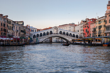 Heading towards the Rialto Bridge as the sun sets over the Grand Canal and Venice
