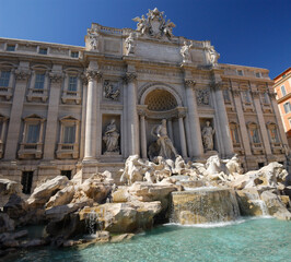 Fototapeta na wymiar Baroque Trevi fountain facade to Poli Palace in Rome