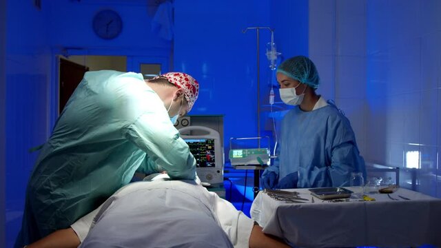 Surgeon doing surgery in operating room in hospital
