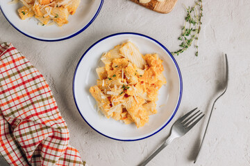 Creamy roasted butternut pumpkin tortiglioni pasta with parmesan cheese and thyme.