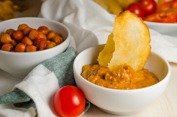 Indian cuisine. Luchi tortillas with cooked and fresh vegetables.