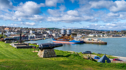 Old naval fortifications and cannons with rusty anchor as landmark and tourist attraction in...