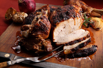 A beer battered holiday turkey sliced and dripping juice