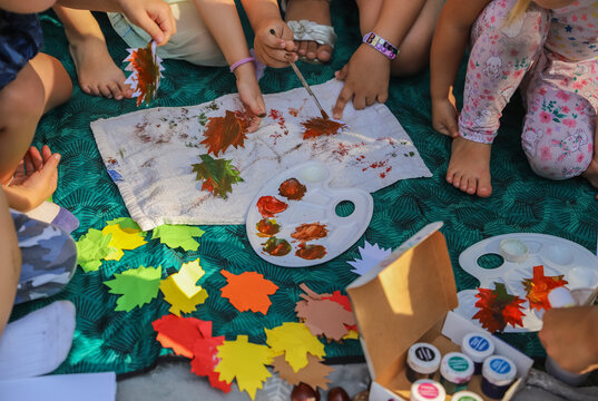 Children's art and craft of leaves made from paper and paints