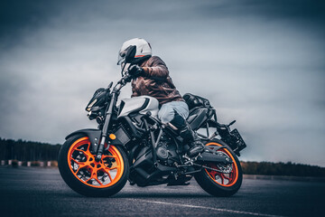 Fototapeta na wymiar biker rides on the road on a motorcycle
