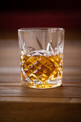 Whiskey glass on a table.