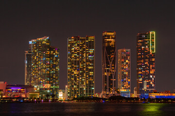 Fototapeta na wymiar Miami, Florida, USA skyline on Biscayne Bay, city night backgrounds. Panoramic view of Miami skyline and coastline.