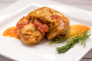 Cabbage rolls on a plate.