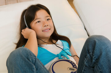 Girl Listening to Music on CD Player