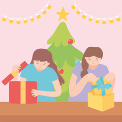happy girls opening gift boxes in the christmas party