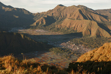 Fototapeta premium Sembalun village landscape in east lombok filled with fog in the morning, view from Pergasingan Hill