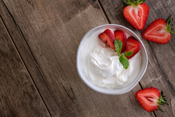 White Yogurt with Fresh Fruit in a Bowl. Top View. Copy Space.