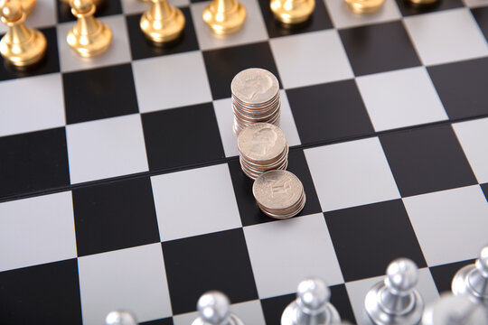 A Row Of Dollar Coins In The Center Of The Chess Board And Chess In A Standoff