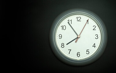 white clock Isolated showtime 07.54 o'clock on black background, Copy space for your text, Time concept.