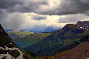 Fototapeta na wymiar Montana -Dark Clouds drifting over Going to the Sun Road Mountain Range
