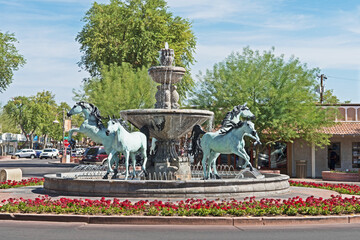 A bronze horse fountain situated in a central square in Old Town Scottsdale, Arizona. - Powered by Adobe