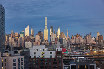 Fototapeta na wymiar Sunrise over Manhattan NY of skyscrapers and skyline reflecting the sun at twilight hour