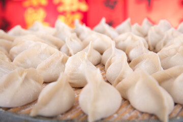 Fototapeta na wymiar Close-up shot of dumplings for Chinese festival on tray