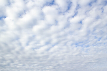 White puffy clouds in blue sky