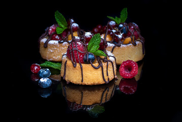 Assorted berries dessert cups with custard and chocolate 