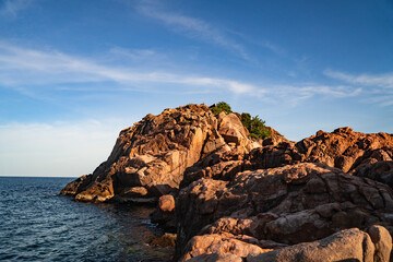 Fototapeta na wymiar A tropical island with Cliffs and perfect bly sky at Long Beach Redang Islands, Malaysia
