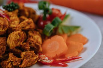 Herbs Fried chicken with Chili, Tomato, Cucumber, Carrot, and Fresh pepper.