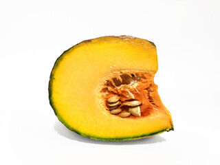 Fresh pumpkin cut into pieces On a white background