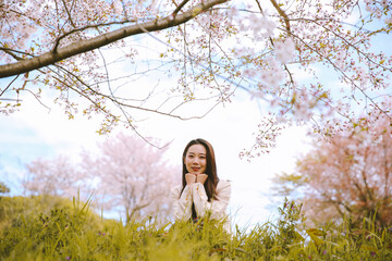 Fototapeta na wymiar Girl and cherry blossoms in spring, Kyoto, Japan