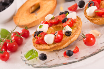 Friselle with tomatoes and mozzarella cheese.