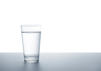 A clear glass of water on a white background