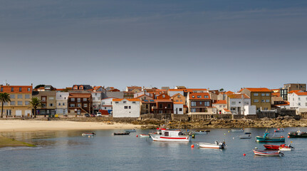 Fototapeta na wymiar Fishing port and town of Santa María de Corrubedo. Ribeira, La Coruña, Galicia, Spain.