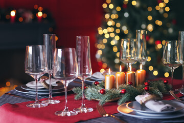Beautiful table setting with Christmas decorations in living room