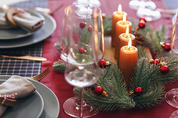 Beautiful table setting with candles for Christmas dinner