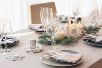 Beautiful table setting with Christmas decorations in living room