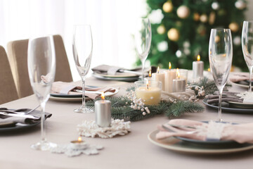 Beautiful table setting with Christmas decorations in living room
