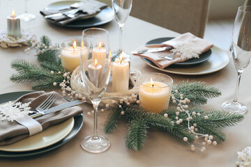 Beautiful table setting with Christmas decorations in living room