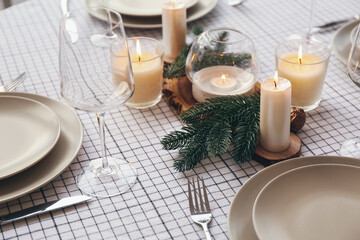 Obraz na płótnie Canvas Beautiful table setting with candles for Christmas dinner