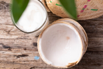 Fototapeta na wymiar Coconut water in a glass and young coconut