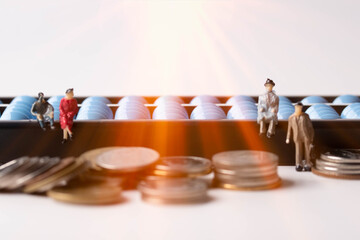 miniature people. Abacus and coin. Finance and business ideas.