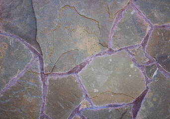 Wall texture made of large chunks of chipped stone. Background